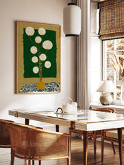 Stylised lantern plant wall art with golden stem, white spheres, dark green panel, and blue wave, in a styled room mockup