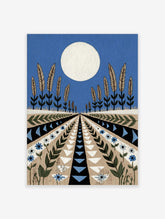 Stylised landscape art print with large white moon, wheat plants, and geometric patterned fields in blue, beige, and black