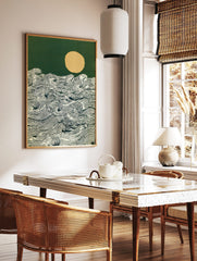 Stylised ocean waves with detailed lines, a pale yellow moon, and a dark green sky art print, in a styled room mockup