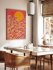 Stylised ocean waves wall art with a large golden sun, red sky, and layered waves in red, yellow, in a styled room mockup
