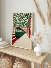 Green subway train at a station with red tracks and green leaves overhead, in an illustrative subway art print style. - Image 3
