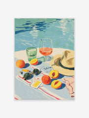 Illustrative summer still life with peaches, wine, water glass, sunglasses, and hat by a blue pool