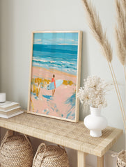 Impressionist painting of a surfer with a light blue board walking on a sandy beach towards, in an alternate framed mockup