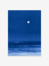 Minimalist blue night sea art print featuring a lone surfer gliding under a large full moon