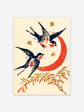 Two swallows flying around a red crescent moon with gold stars and a branch, on cream paper