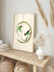 Two green swallow birds in flight inside a golden brushstroke circle, Japanese inspired art, in an alternate framed mockup