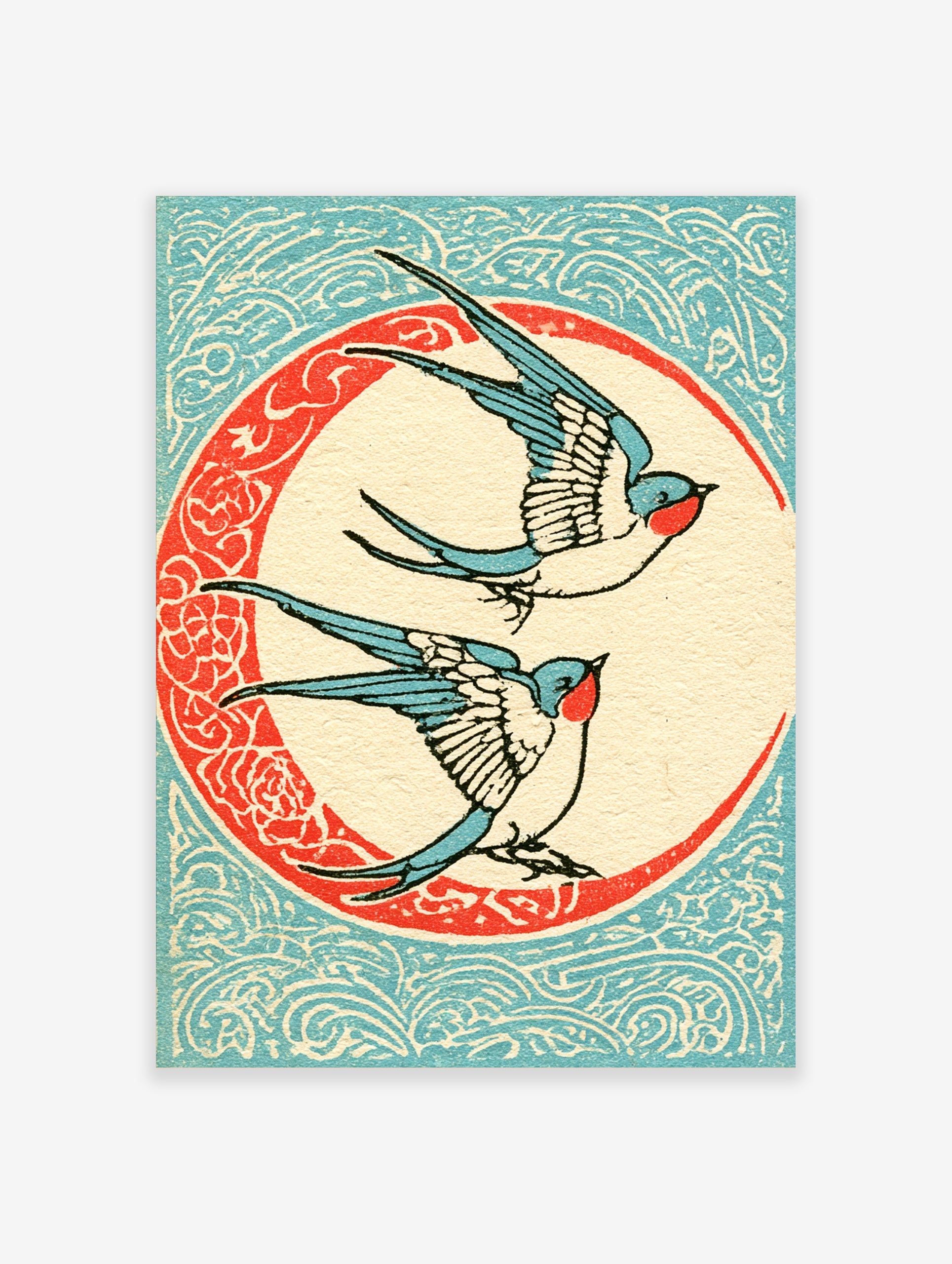 Vintage illustrative art print of two swallow birds flying inside a decorative circular frame on a blue patterned background