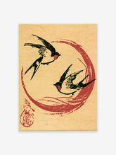 Two black swallows flying within a red circle on a tan paper background, Japanese-style art print