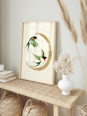Two swallows in ink-wash style flying within a gold enso circle, Japanese minimalist art, in an alternate framed mockup