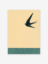 Japanese style art print featuring a black swallow flying against a yellow sky above a teal patterned band.