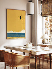 Minimalist swallow bird wall art flying over blue ocean waves and golden sand under a vibrant yellow sky illustration. - Image 2