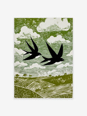 Stylised linocut print of two black swallows flying over green fields and white clouds in a green sky