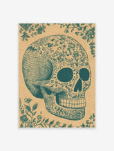 Teal ornate sugar skull illustration with floral patterns and decorative vines on a tan paper background