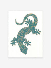 Teal gecko illustration wall art print with golden patterns on a white background, featuring a stylized reptile.