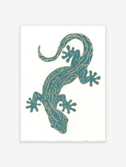 Teal gecko illustration wall art print with golden patterns on a white background, featuring a stylized reptile.