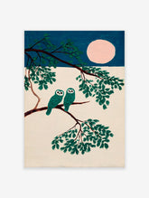Teal owl wall art featuring two stylized owls on a tree branch under a pink full moon against a dark blue sky.