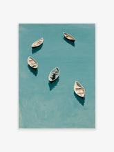 Six white rowing boats on teal water with dark reflections, overhead minimalist coastal print