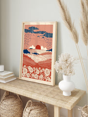 Terracotta landscape wall art print with rolling fields, white flowers, dark blue rain clouds, and a red sun. - Image 3
