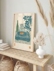 Woodblock style print of a tiger with a record player, orange vinyl, green sake bottle, and, in an alternate framed mockup