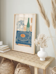 Tiger head, green sake bottle, blue record player with orange record, Japanese woodblock, in an alternate framed mockup