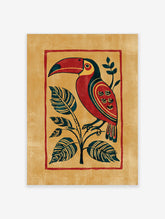 Red and gold toucan art print with dark green leaves on ochre background