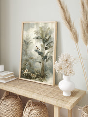Illustrative tropical jungle print with a small bird on a banana leaf, palm plants, and white, in an alternate framed mockup