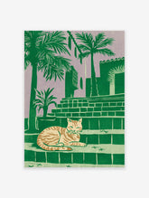 Tropical cat print of a striped feline resting on steps with palm trees and a building against a purple sky.