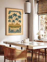 Illustrative tropical beach scene with blue palm trees, brown mountains, water, and decorative, in a styled room mockup