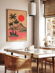 Illustrative tropical island print with palm trees, mountains, red sun, and pink water on tan paper, in a styled room mockup