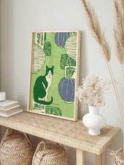 Illustrated Cat Wall Art featuring a black and white tuxedo cat sitting among green and purple lanterns on a green background. - Image 3