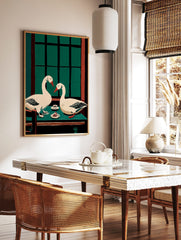 Illustrative wall art of two white geese with red beaks at a green table with cake and a window, in a styled room mockup