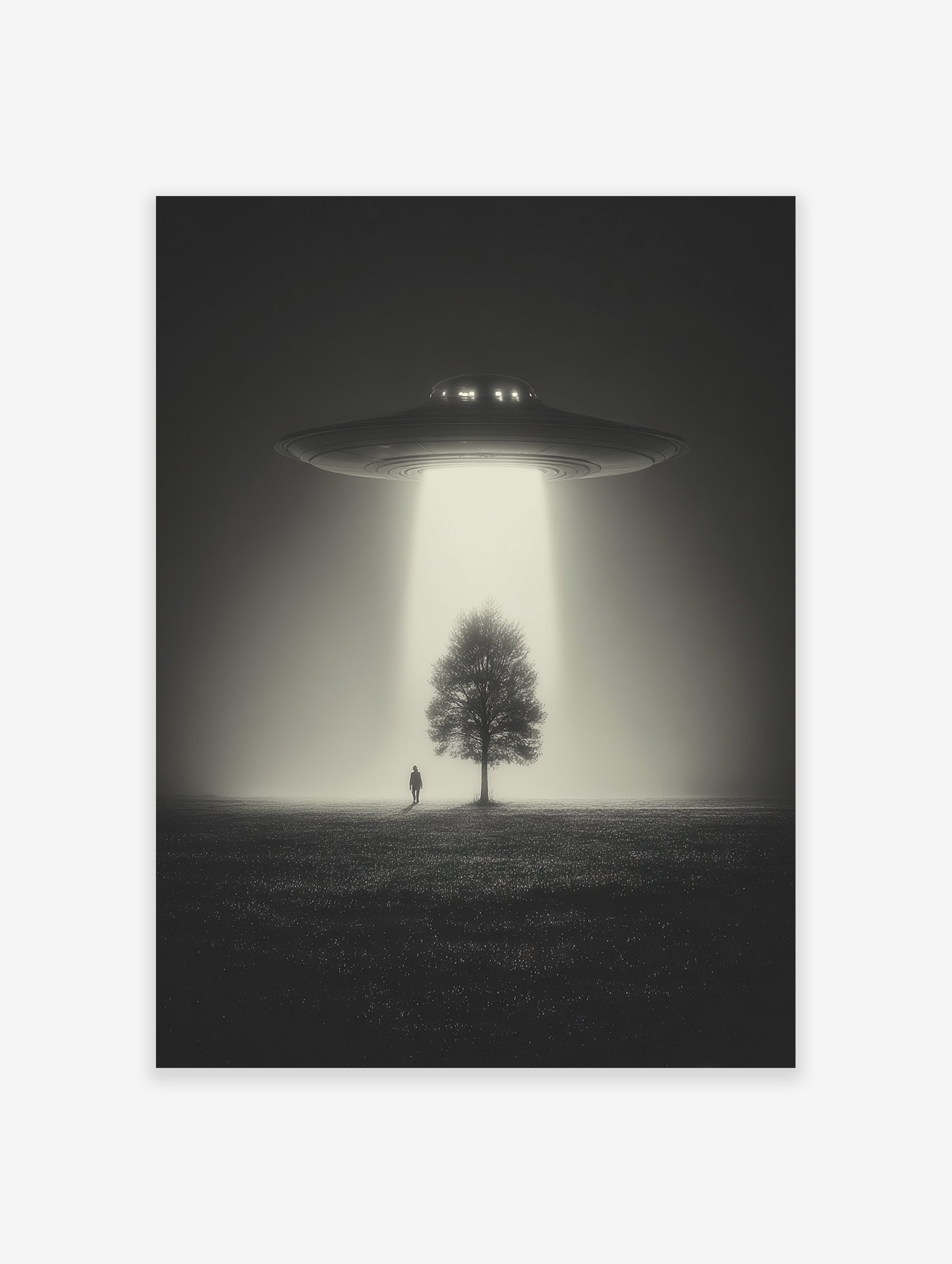 Black and white UFO art print with a spaceship beaming light onto a tree and a person in a misty field.