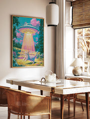 Surreal art print of a tabby cat being abducted by a glowing UFO in a vibrant, retro-styled, in a styled room mockup