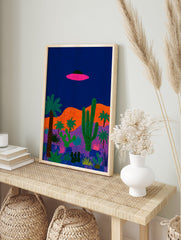 Illustrated UFO desert landscape poster with a pink flying saucer, green cacti, and palm trees against a dark blue sky. - Image 4