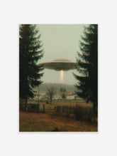 UFO flying saucer with a light beam hovers over a misty village framed by two dark evergreen trees. Mysterious sci-fi wall art.
