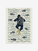 Illustrative print of a navy blue scuba diver with olive flippers swimming among fish and water ripples