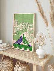 Illustrated Venice pigeon wall art with a purple and green pigeon on a balcony overlooking a canal and buildings. - Image 3