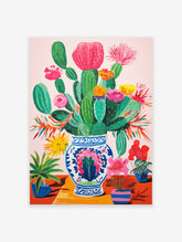Vibrant botanical poster featuring colorful cacti and flowering plants in a blue and white patterned vase on a reddish table.