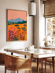 Vibrant abstract landscape wall art featuring an orange field with pink and red flowers, blue mountains, and dark green trees. - Image 2