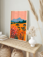 Vibrant abstract landscape wall art featuring an orange field with pink and red flowers, blue mountains, and dark green trees. - Image 3