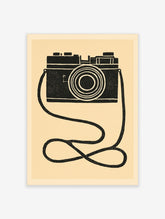 Black and white film camera poster with looping strap and concentric lens rings on cream background