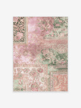 Vintage wall art featuring a botanical patchwork print with pink and green floral patterns and ornate borders on a light background.