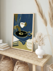Modern illustration of a person with a teacup and vinyl record player in blue and gold tones, in an alternate framed mockup