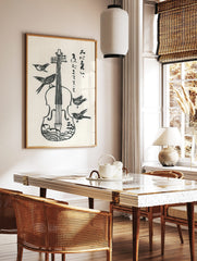 Monochrome woodcut style print of a violin with four birds and vertical Japanese script, in a styled room mockup