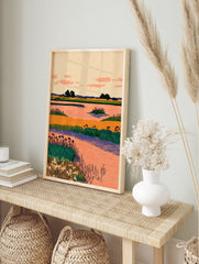 Stylized wetland landscape wall art with orange water, green reeds, dark trees, and a peach sky with pink clouds. - Image 3