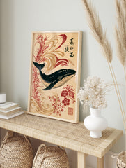 Japanese-style whale art print with red flowers, calligraphy, and swirling wave patterns on a, in an alternate framed mockup