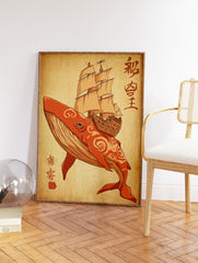 Orange whale carrying a sailing ship on its back, with red cultural calligraphy on a beige parchment background. Whale Ship Art Print. - Image 2