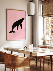 Black humpback whale silhouette illustration on a solid soft pink background, minimalist wall art, in a styled room mockup