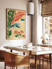 Illustrative whale wall art with green seaweed, red floral motifs, and abstract red shapes on a, in a styled room mockup