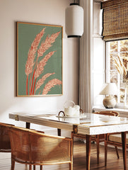 Illustrative wheat stalks with pale orange grain heads and red stems on a teal green background art, in a styled room mockup